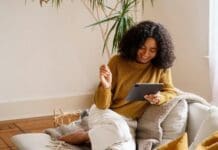 How Online Leisure Activities Are Shaping Modern Culture Woman enjoying her alone time online using a tablet.